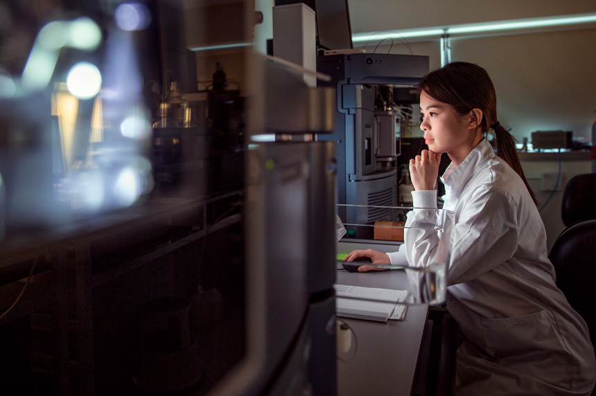 Woman in working in lab at night