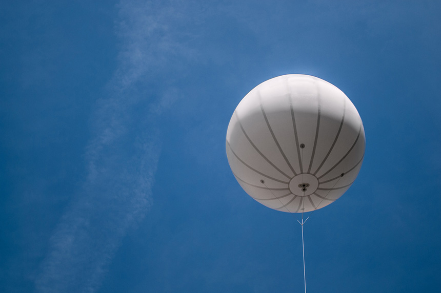 white balloon floating in the sky